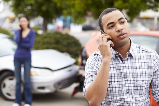 Male Driver Making Phone Call After Traffic Accident