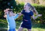 School's out kids playing with bubbles